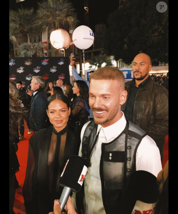 M.Pokora et Christina Milian avant de monter les marches du Palais des Festivals et des Congrès de Cannes pour la 21e cérémonie des NRJ Music Awards, le 9 novembre 2019.