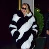 Exclusif - Céline Dion porte un manteau de fourrure XXL Saint Laurent noir et blanc, des bas La Perla, des talons Gianvitto et des lunettes de soleil Versace pour aller dîner à New York, le 13 novembre 2019