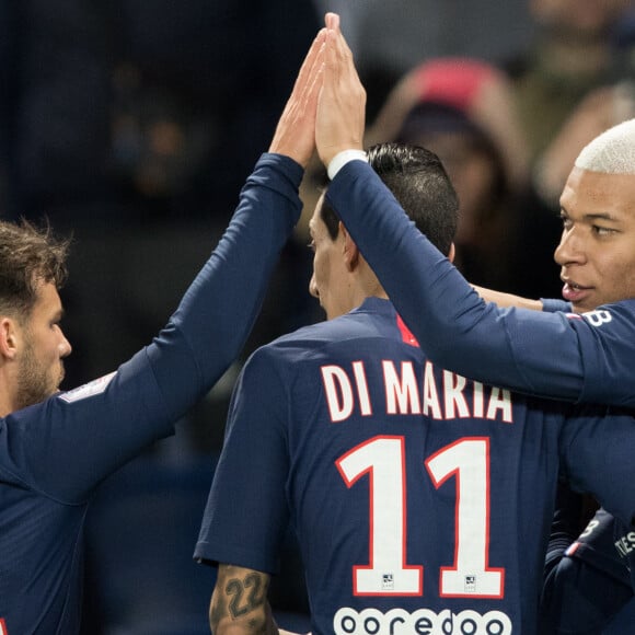 Juan Bernat, Angel Di Maria et Kylian Mbappé lors du match de Ligue 1 Conforama Paris Saint-Germain - Amiens SC au Parc des Princes. Paris, le 21 décembre 2019.