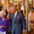  Le prince Harry et Meghan Markle, duc et duchesse de Sussex, avec le prince William et Kate Middleton, duc et duchesse de Cambridge, accompagnant la reine Elizabeth II et le prince Charles lors d'une réception pour les 50 ans de l'investiture du prince de Galles au palais Buckingham à Londres le 5 mars 2019. 