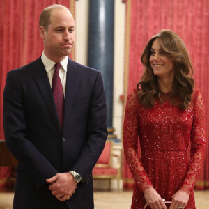 Le prince William, duc de Cambridge, et Kate Middleton, duchesse de Cambridge, accueillent les invités de la réception organisée pour le début du "Sommet Grande-Bretagne-Afrique sur les investissements" à Buckingham Palace, le 20 janvier 2020.