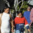 Christina Milian, enceinte, dans une robe moulante blanche à la sortie de chez Fred Segal's avec son compagnon M.Pokora et sa fille, Violet Madison Nash, après avoir déjeuné avec des amis, à Los Angeles, Californie, Etats-Unis, le 7 janvier 2020.