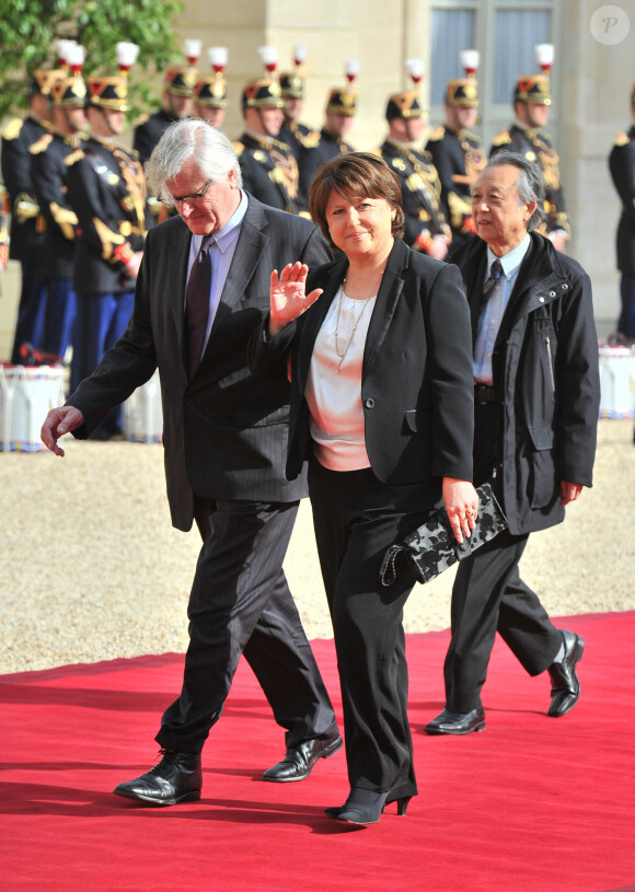Martine Aubry et son mari Jean-Louis Brochen - Investiture de François Hollande comme président de la République, à Paris, en 2012.