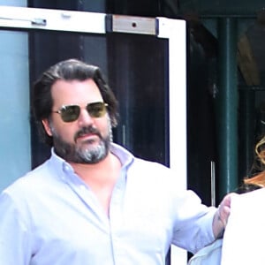 Poppy Montgomery et son mari Shawn Sanford arrivent dans les studios AOL à New York, le 26 juillet 2019.