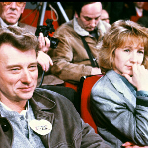Johnny Hallyday et Nathalie Baye aux Restos du coeur en 1986.