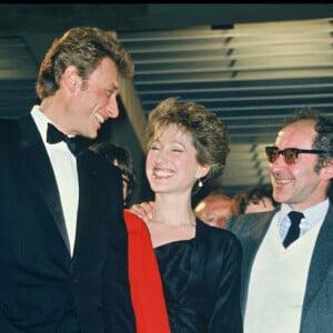 - Johnny Hallyday, Nathalie Baye et Jean-Luc Godard au Festival de Cannes en 1985.