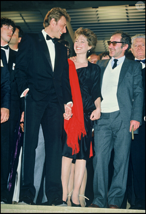 - Johnny Hallyday, Nathalie Baye et Jean-Luc Godard au Festival de Cannes en 1985.