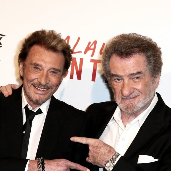 Johnny Hallyday et Eddy Mitchell - Avant-première de 'Salaud on t'aime' à l'UGC Normandie sur les Champs-Elysées à Paris le 31 mars 2014.