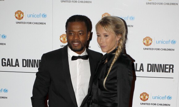 Patrice Evra et sa femme Sandra lors du diner de gala de charite pour l'UNICEF, a Manchester, le 19 decembre 2012.