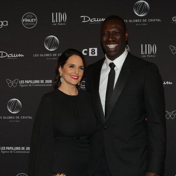 Omar Sy et sa femme Hélène au photocall de la 11ème cérémonie des Globes de Cristal au Lido à Paris le 30 janvier 2017. © CVS / Bestimage 