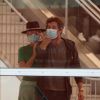 Exclusif - Laeticia Hallyday et son compagnon Pascal Balland arrivent à l'aéroport Roissy CDG après une échappée de trois jours à Florence, sans enfants, le 30 juin 2020. Le couple est resté séparé pendant le confinement lors de l'épidémie de coronavirus (COVID-19). Ils suivent les recommandations concernant le port du masque dans les transports mais ne résistent pas à échanger un baiser malgré leur barrière de tissu. 