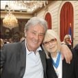 Exclusif - Alain Delon et Mireille Darc lors de la cérémonie de remise des insignes de commandeur de l'Ordre national du mérite à Mireille Darc au palais de l'Elysée le 21 avril 2010.