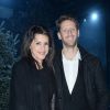 Romain Grosjean et sa femme Marion Jollès au défilé de mode Moncler Gamme Bleu collection Printemps-Eté 2017 lors de la fashion week Homme à Milan, le 15 janvier 2017.