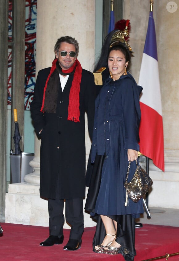 Info - Jean-Michel Jarre officialise avec Gong Li - Jean-Michel Jarre et sa compagne Gong Li - Dîner d'Etat du président de la République française en l'honneur du président de la République populaire de Chine lors de sa visite d'Etat en France du 24 au 26 mars 2019, au Palais de l'Elysée, à Paris, France, le 25 mars 2019. © Dominique Jacovides/Bestimage