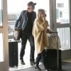 Exclusif - Emma Roberts, enceinte et son compagnon Garrett Hedlund au départ de l'aéroport LAX avec leurs valises Louis Vuitton. Ils portent des masques pour se protéger de l'épidémie de Coronavirus (COVID-19).