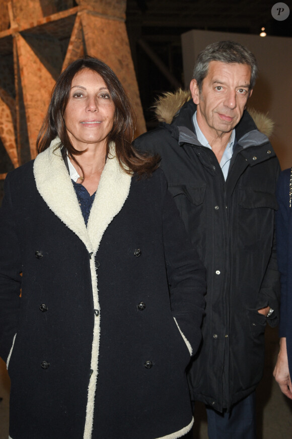 Exclusif - Michel Cymes et sa femme Nathalie - Dîner à la fondation Cartier au profit de La Chaîne de l'Espoir à Paris, le 14 décembre 2018. © Coadic Guirec/Bestimage 