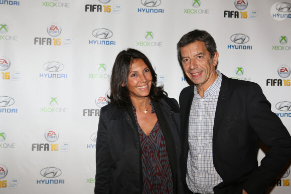 Michel Cymes et sa femme Nathalie - Soirée de lancement du jeu vidéo "FIFA 2016" au Faust à Paris, le 21 septembre 2015. 
