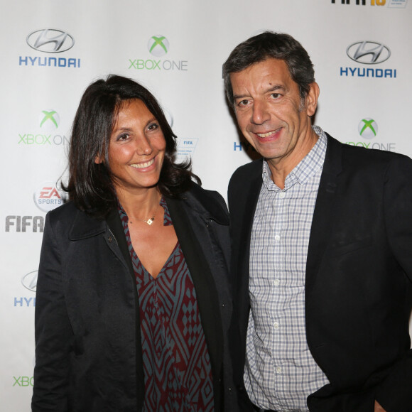 Michel Cymes et sa femme Nathalie - Soirée de lancement du jeu vidéo "FIFA 2016" au Faust à Paris, le 21 septembre 2015. 