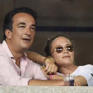 Olivier Sarkozy et Mary-Kate Olsen complices lors du tournoi de l'US Open à Flushing le 1er septembre 2014. 