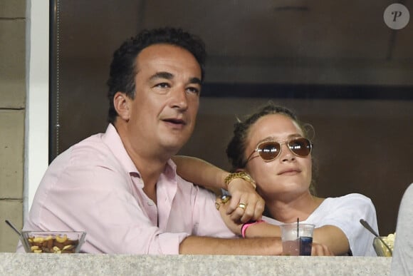 Olivier Sarkozy et Mary-Kate Olsen complices lors du tournoi de l'US Open à Flushing le 1er septembre 2014. 