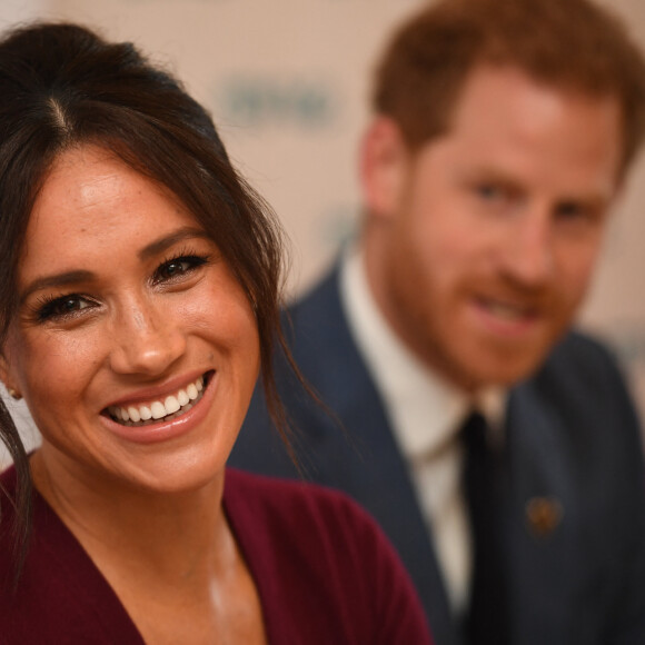 Le prince Harry, duc de Sussex, et Meghan Markle, duchesse de Sussex, participent à une réunion sur l'égalité des genres avec les membres du Queen's Commonwealth Trust (dont elle est vice-présidente) et du sommet One Young World au château de Windsor, le 25 octobre 2019.