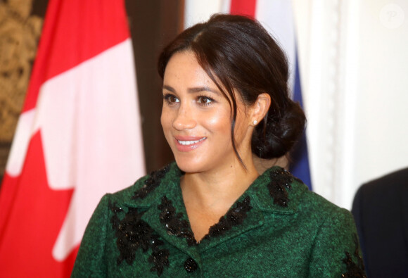 Meghan Markle la duchesse de Sussex enceinte et le prince Harry, duc de Sussex, assistent à une activité jeunesse le Jour du Commonwealth à la Maison du Canada le 11 mars 2019 à Londres 