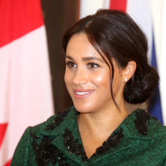 Meghan Markle la duchesse de Sussex enceinte et le prince Harry, duc de Sussex, assistent à une activité jeunesse le Jour du Commonwealth à la Maison du Canada le 11 mars 2019 à Londres 