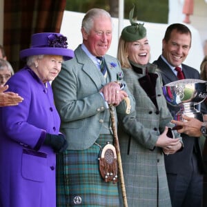 La reine Elisabeth II d'Angleterre, le prince Charles, Autumn Phillips et son mari Peter Phillips lors du "Braemar Highland Gathering" en Ecosse. Le 7 septembre 2019