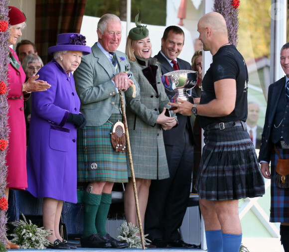 La reine Elisabeth II d'Angleterre, le prince Charles, Autumn Phillips et son mari Peter Phillips lors du "Braemar Highland Gathering" en Ecosse. Le 7 septembre 2019