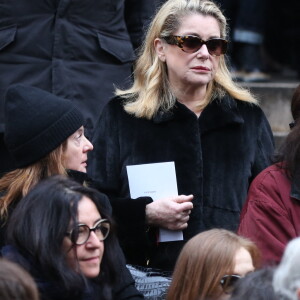 John Nollet et Catherine Deneuve - Sortie des obseques de Kate Barry en l'eglise Saint-Roch a Paris. Le 19 decembre 2013