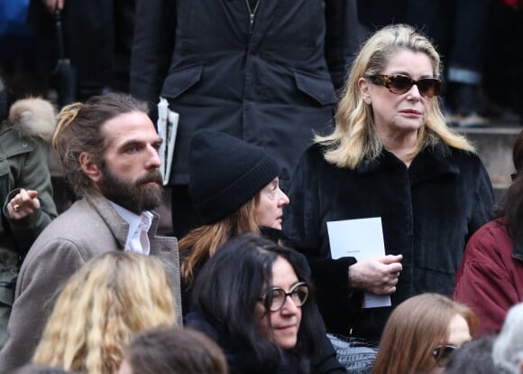 John Nollet et Catherine Deneuve - Sortie des obseques de Kate Barry en l'eglise Saint-Roch a Paris. Le 19 decembre 2013