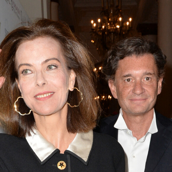 Carole Bouquet et son compagnon Philippe Sereys de Rothschild - Photocall de la 4ème édition du Gala " Planet Finance" au Carlton lors du 67ème festival international du film de Cannes. Le 15 mai 2014.