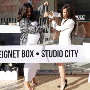 Christina Milian, enceinte, inaugure son food truck Beignet Box à Studio City le 9 avril 2021.  04/09/2021 Christina Milian is spotted at her Beignet Box grand opening in Studio City. The 39 year old American actress appeared to be in high spirits as she cut the ribbon and celebrated with friends and family. Christina showed off her growing baby bump in a long tight white dress under a black and white pattern shirt. VIDEO AVAILABLE 