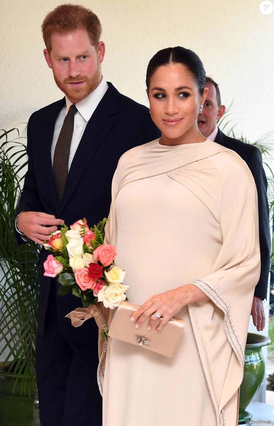 Le prince Harry, duc de Sussex, et Meghan Markle, duchesse de Sussex, enceinte assistent à une réception organisée par l'ambassadeur britannique au Maroc, Thomas Reilly, à la résidence britannique de Rabat, le 24 février 2019, dans le cadre de leur voyage officiel au Maroc.