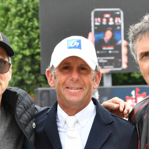 Guillaume Canet (arbore la moustache d'Astérix pour les besoins de son rôle dans "Astérix et Obélix: L'Empire du milieu"), Philippe Rozier et Julien Clerc - Les personnalités assistent au Longines Paris Eiffel Jumping au Champ de Mars, le 27 juin 2021. © Veeren / Bestimage 