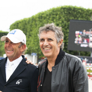 Guillaume Canet ( avec son look pour le film Asterix), Philippe Rozier et Julien Clerc - Les personnalités assistent au Longines Paris Eiffel Jumping au Champ de Mars, le 27 juin 2021. © JB Autissier / Panoramic / Bestimage 