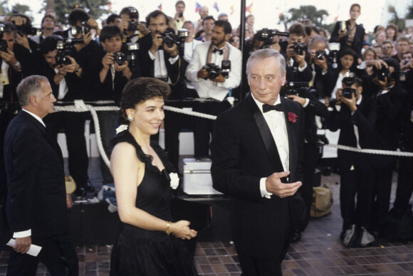 Yves Montand et sa femme Carole Amiel au Festival de Cannes en 1989. © Michel Marizy via Bestimage
