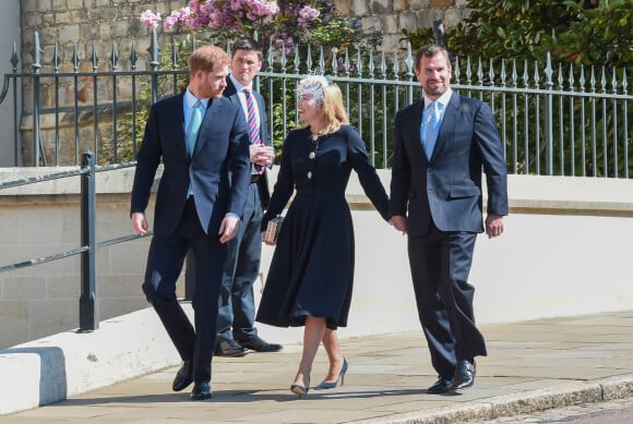 Le prince Harry, duc de Sussex, Peter Phillips et Autumn Phillips arrivent pour assister à la messe de Pâques à la chapelle Saint-Georges du château de Windsor, le 21 avril 2019.