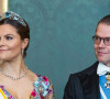 La princesse Victoria de Suède et le prince Daniel lors du dîner d'état au palais royal à Stockholm pour la visite en Suède du couple royal d'Espagne le 24 novembre 2021.