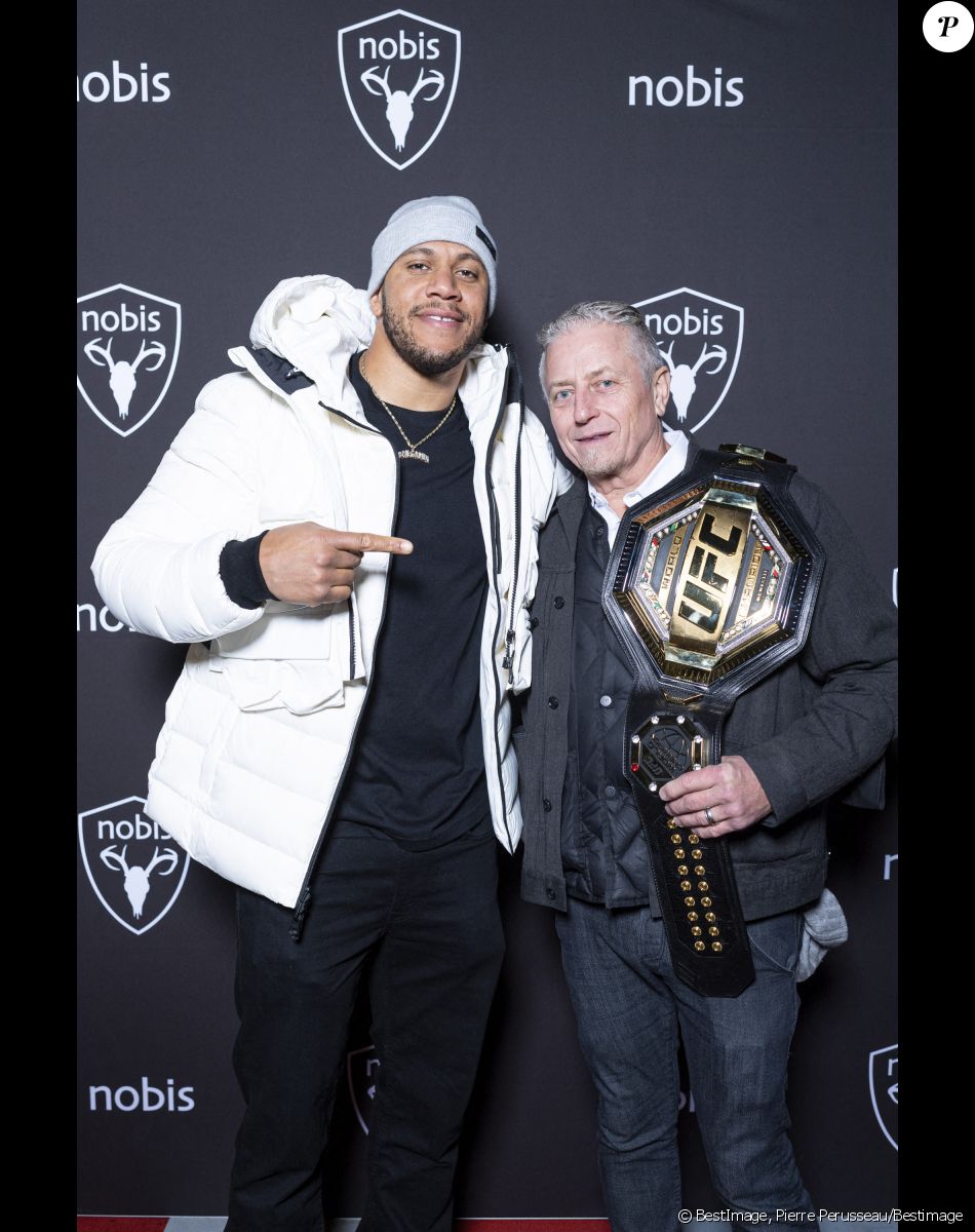 Exclusif - Ciryl Gane (Champion du Monde de MMA poids lourd) et Robin Yates - Nobis fête ses 15 ans en inaugurant sa nouvelle boutique dans le 2ème arrondissement de Paris, France, le 25 novembre 2021. © Pierre Perusseau/Bestimage$