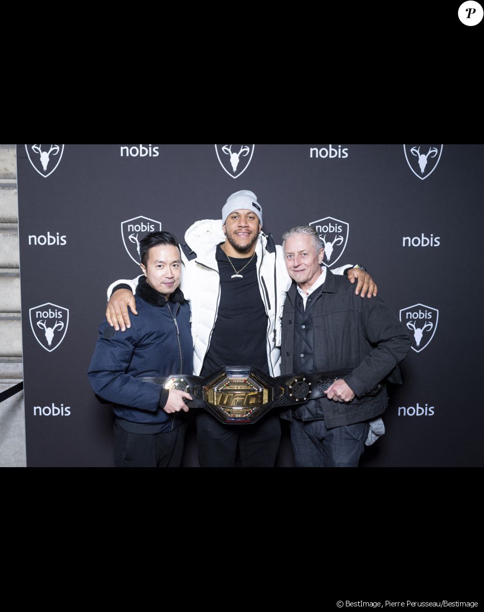 Exclusif - Kevin Yang, Ciryl Gane (Champion du Monde de MMA poids lourd) et Robin Yates - Nobis fête ses 15 ans en inaugurant sa nouvelle boutique dans le 2ème arrondissement de Paris, France, le 25 novembre 2021. © Pierre Perusseau/Bestimage$