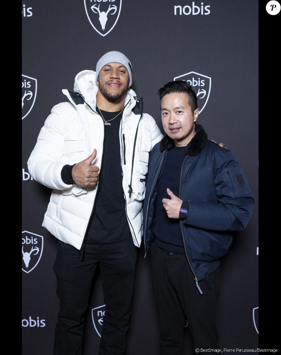Exclusif - Ciryl Gane (Champion du Monde de MMA poids lourd) et Kévin Yang - Nobis fête ses 15 ans en inaugurant sa nouvelle boutique dans le 2ème arrondissement de Paris, France, le 25 novembre 2021. © Pierre Perusseau/Bestimage$