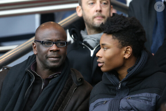 Lilian Thuram et son fils Khephren - People au match de Ligue 1 PSG - Reims lors de la 27ème journée au Parc des Princes à Paris, le 20 février 2016.