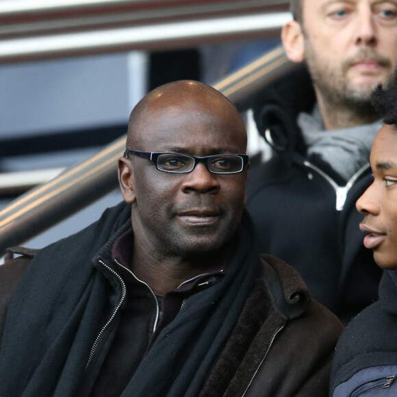 Lilian Thuram et son fils Khephren - People au match de Ligue 1 PSG - Reims lors de la 27ème journée au Parc des Princes à Paris, le 20 février 2016.