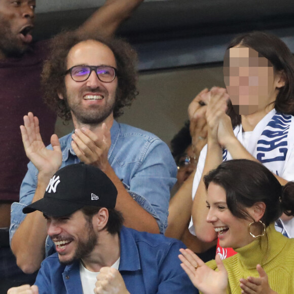 Sylvain Wiltord, Thomas Bangalter (groupe Daft Punk), son fils Tara-Jay, François Civil, Joséphine Japy et Alicia Aylies dans les tribunes lors de la Ligue des nations opposant la France aux Pays-Bas, au Stade de France, à Saint-Denis, Seine Saint-Denis, France, le 9 septembre 2018. © Cyril Moreau/Bestimage 