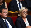 Louis Aliot, sa compagne Marine Le Pen lors d'une séance de questions au gouvernement à l'Assemblée Nationale à Paris, le 5 juillet 2017.