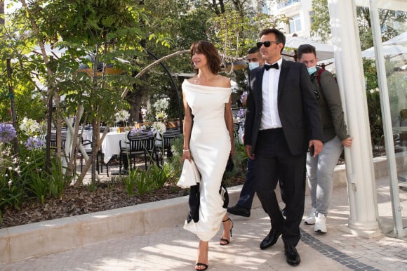 Exclusif - Sophie Marceau et François Ozon à la sortie de l'hôtel "Martinez" lors du 74ème Festival International du Film de Cannes, le 7 juillet 2021. © Laurent Campus/Bestimage