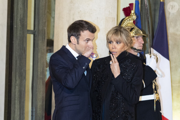Le président Emmanuel Macron et Brigitte Macron - Arrivées au dîner offert par le président de la République en l'honneur de M. Marcelo Rebelo de Sousa, Président de la République portugaise au palais de l'Elysée à Paris le 11 février 2022.