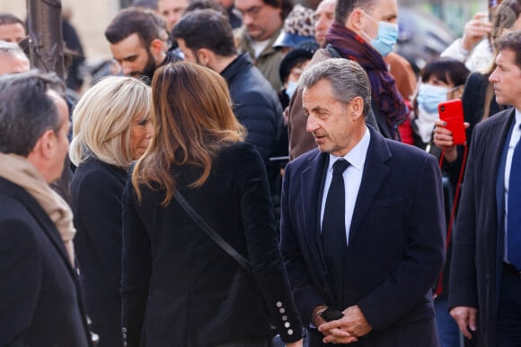 Brigitte Macron, Carla Bruni, Nicolas Sarkozy - Obsèques de Jean-Pierre Pernaut en la Basilique Sainte-Clotilde à Paris le 9 mars 2022.