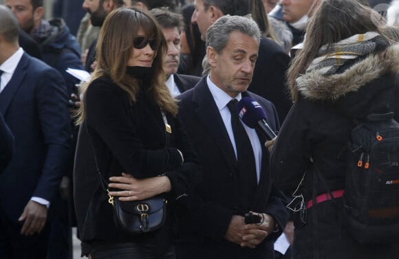 Nicolas Sarkozy et sa femme Carla Bruni-Sarkozy - Obsèques de Jean-Pierre Pernaut en la Basilique Sainte-Clotilde à Paris le 9 mars 2022. © Denis Guignebourg/ Bestimage